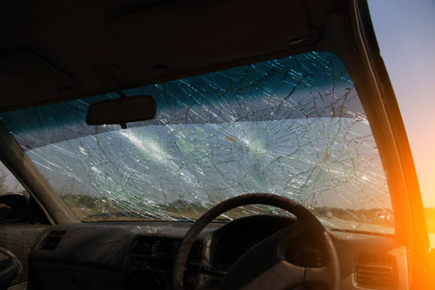 istock Inside of car with the broken windshield during road accident 1348230770