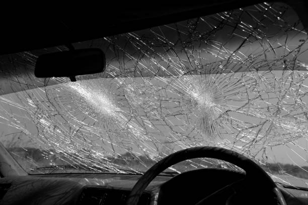 istock Inside of car with the broken windshield during road accident 1348231548