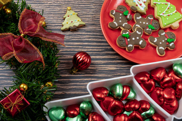 istock Sugar coated biscuits and Christmas theme cookies on a red ceramic plate. 1348231640