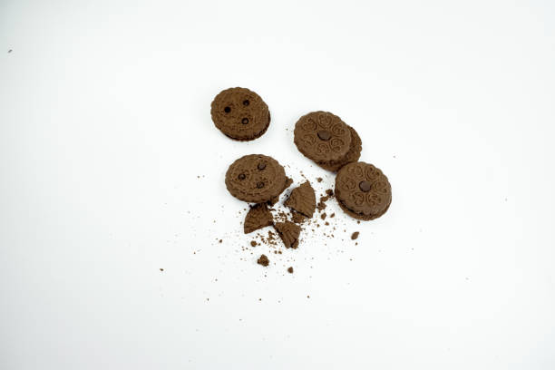 istock Pile of round chocolate biscuits on white background 1348234034