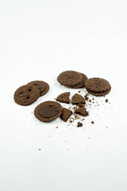 istock Pile of round chocolate biscuits on white background 1348234145
