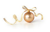 Golden christmas ball with a ribbon decoration, isolated on white background.