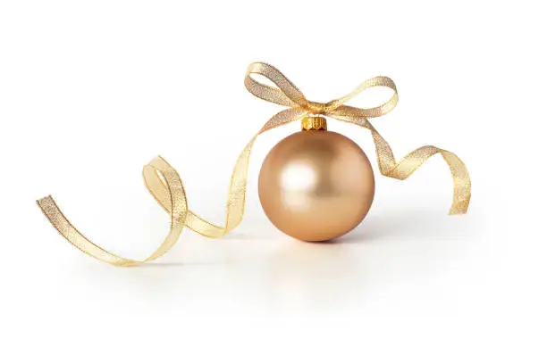 Golden bauble, christmas ball with a ribbon decoration, isolated on white background.