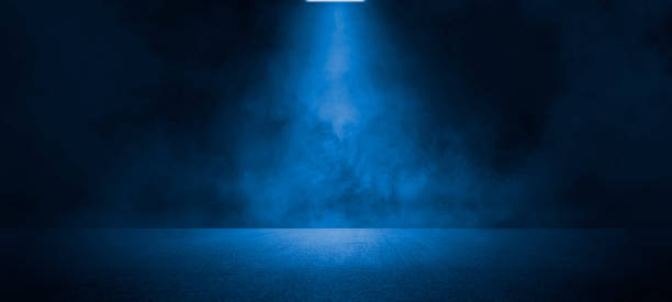 Empty dark blue abstract cement wall and studio room with smoke float up Empty dark blue abstract cement wall and studio room with smoke float up the interior texture for display products wall background dark road stock pictures, royalty-free photos & images