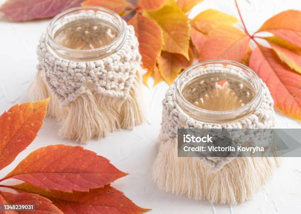 Small Glass Vases Jars Candleholders With Macrame Cover Beautiful Yelloworange Autumn Leaves On Background Boho Style Bohemian Home Decor Wedding Accessory Stock Photo - Download Image Now
