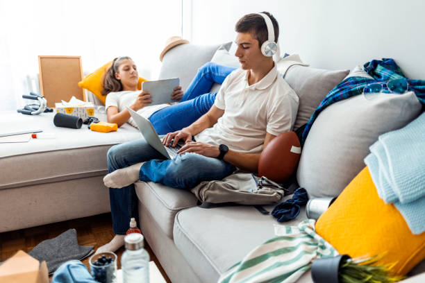 istock Teenagers in messy room 1348239201