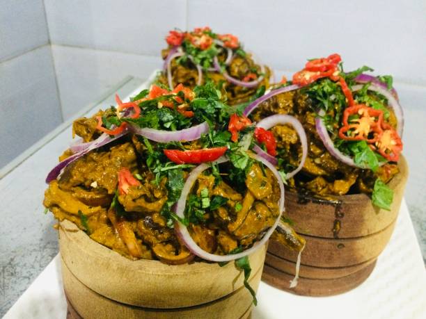 Traditional Eastern Nigerian recipe prepared with Goat meat, spices, seasonings, vegetables and palm oil.