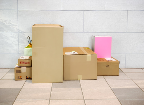 Low-angle view of many cardboard boxes on floor
