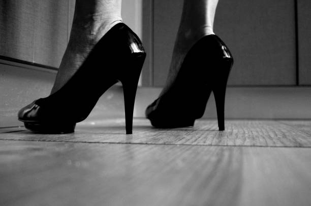 Female legs on a high heels. stock photo