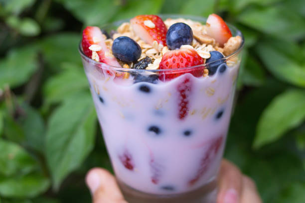 istock glass with yogurt, cereals, strawberries and blueberries 1348247993