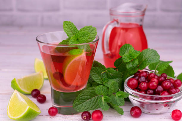 istock Cranberry, lime and mint cocktail. Refreshing vitamin drink. 1348248009