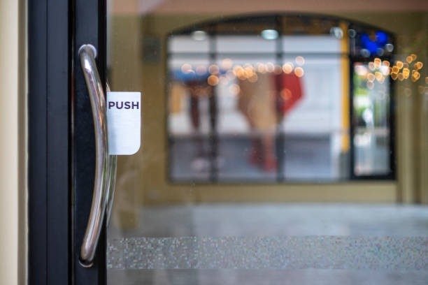 istock Restaurant door handle with push sign on glass doors 1348249280