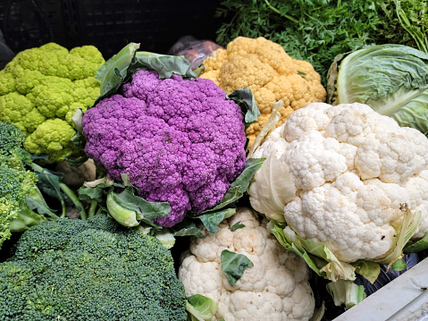Purple, white and yellow cauliflower at the farmers market