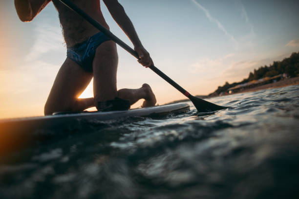 istock Senior man paddling board 1348253803