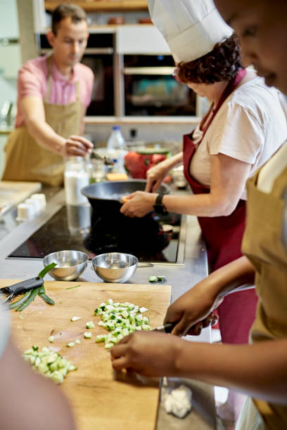 istock Chef and Adult Students Preparing Gazpacho in Cooking Class 1348253982