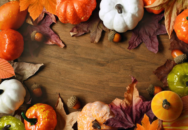 istock Creative pattern, autumn background. Pumpkin and leaves on a wooden background. Halloween. 1348255564
