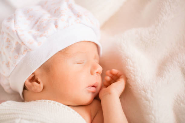 istock baby sleeps in bed. newborn boy, firstborn. copy space for text 1348256379