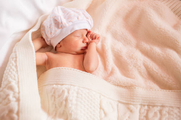 istock newborn lies on a changing table. copy space for text 1348256631