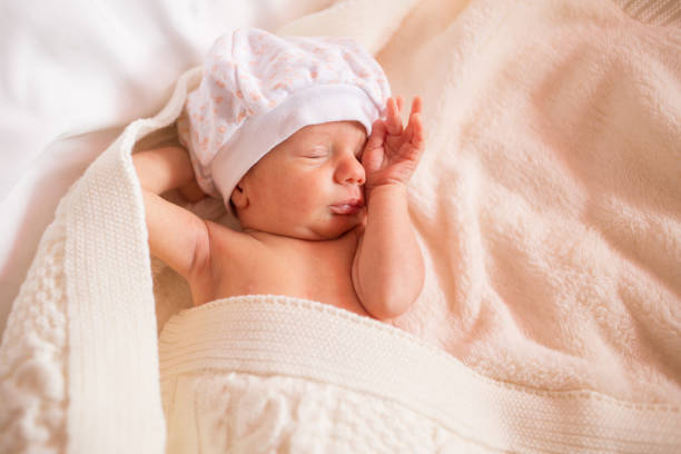 istock newborn lies on a changing table. copy space for text 1348256713