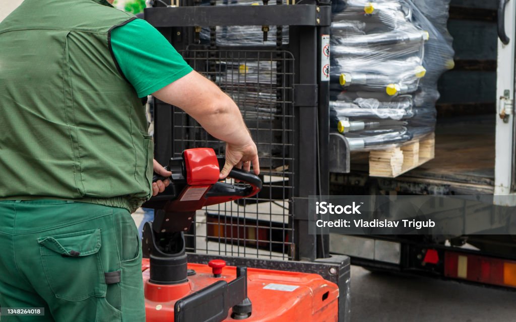 Loading Representative Loading Products Into A Truck Using A Forklift The Operator Controls ...
