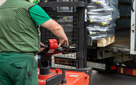 Operator Loading Tool Loading Products Into A Truck Using A Forklift The Operator Controls ...