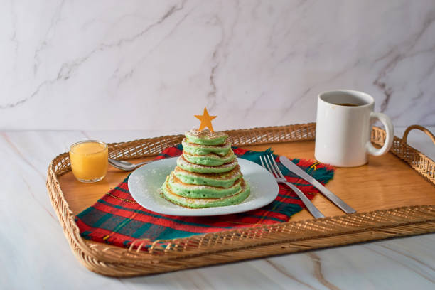 istock Christmas tree shaped pancakes on the table. Christmas breakfast concept 1348264043