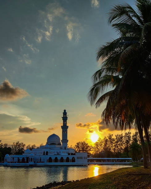 istock Amazing sunset at beautiful mosque on the lake 1348265997