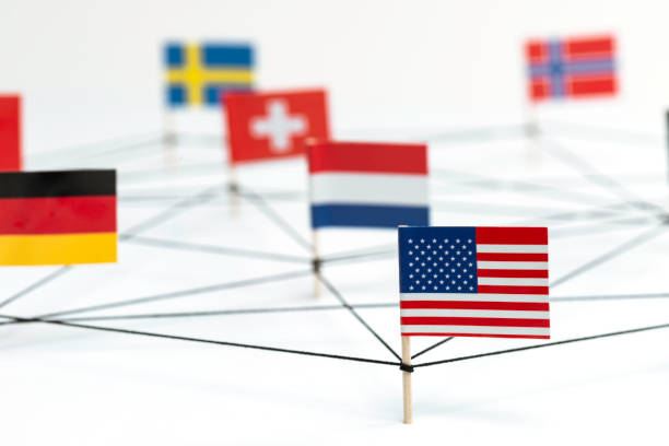Global Relations German, Netherlands, American, Swiss, Sweden and Norway flags are connected with a black string building a graph on white background. Graph is representing trading, financial and political relations. global patent stock pictures, royalty-free photos & images