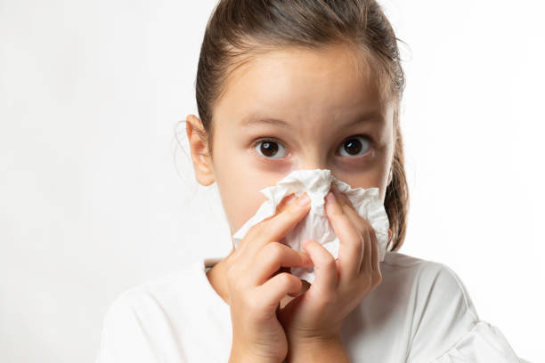 istock Little Girl Cleaning Her Nose 1348270579
