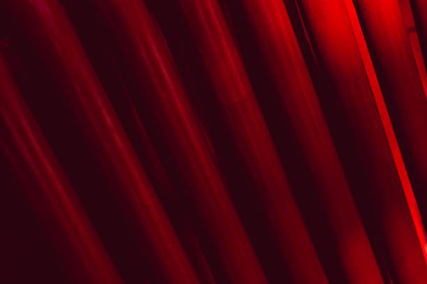 istock Abstract industrial background from pipes painted in red. 1348274262