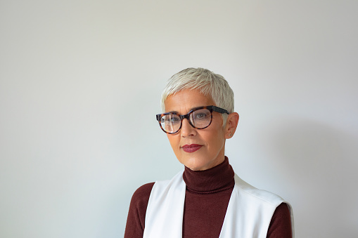 A portrait of a beautiful Caucasian senior businesswoman with short gray hair