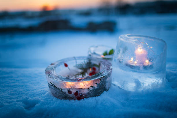 istock Candlesticks made from ice with warm candlelight on a cold winter evening 1348276498