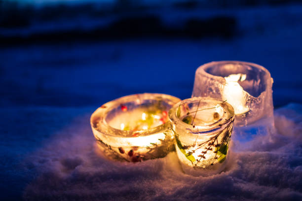 istock Candlesticks made from ice with warm candlelight on a cold winter evening 1348276657