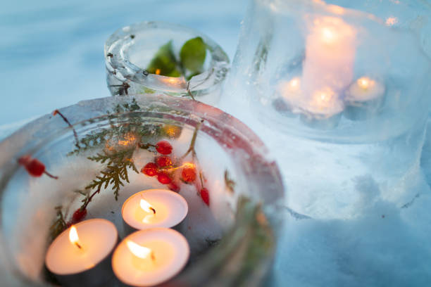 istock Candlesticks made from ice with warm candlelight on a cold winter evening 1348276702