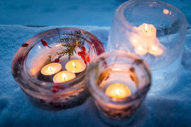 istock Candlesticks made from ice with warm candlelight on a cold winter evening 1348277218