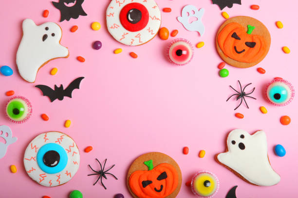 istock Halloween sweets on colored background close up top view with place for text 1348277244