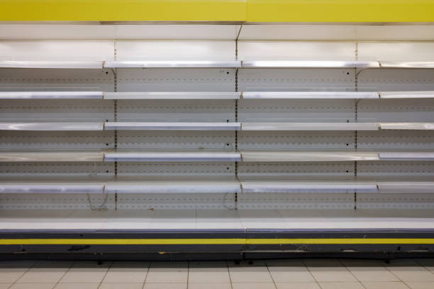 istock empty supermarket grocery shelves 1348279942