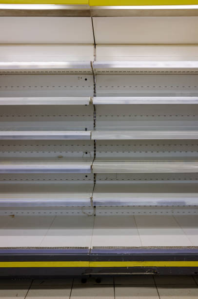 istock empty supermarket grocery shelves 1348279951