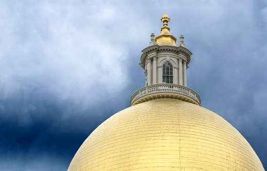 Constructed in the late 1700's, the wooden dome atop the Massachusetts State House in Boston was originally painted gray to appear like stone.  It was first gilded with gold leaf in 1874 and later, in 1997, re-gilded with 23 carat gold.