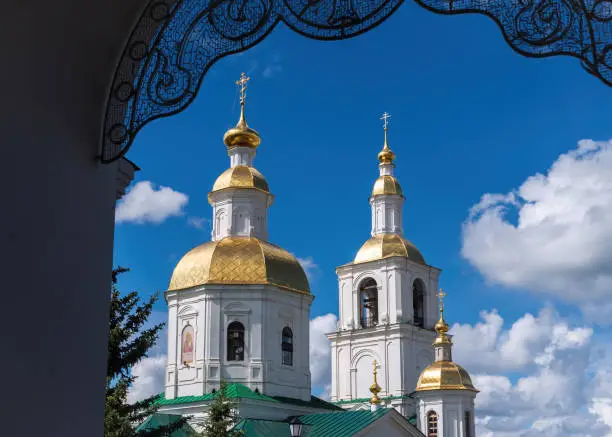 View through the arch to the domes of the Kazan Church, Diveevo, Nizhny Novgorod region, Russia.