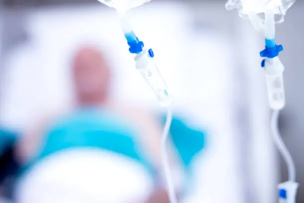 Photo of Patient on bed in Hospital Room interior for background