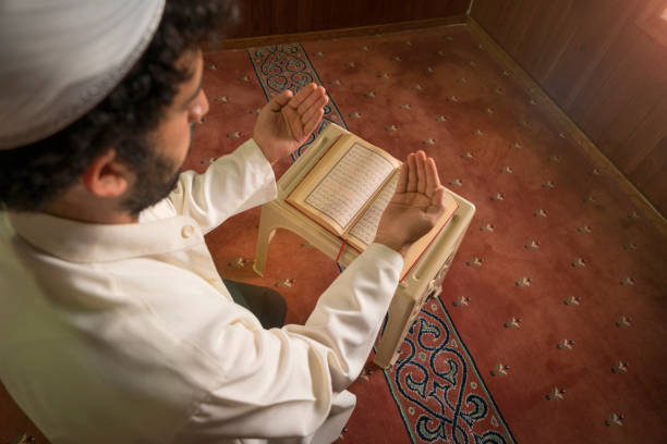 istock Muslims praying in mosque. 1348285413