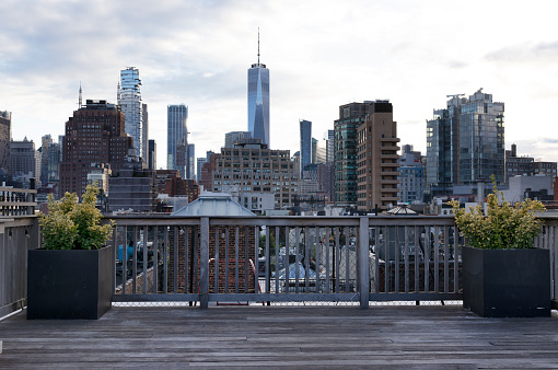 Rooftop terrace with views toward the downtown Manhattan skyline.