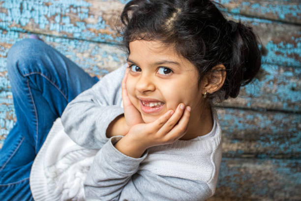 istock Little girl smiling after losing her first tooth 1348287745