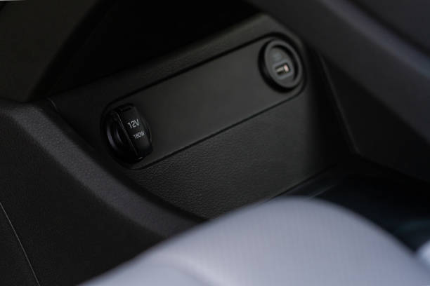 istock 12V power socket in a car. Outlet socket in a car. 1348287755