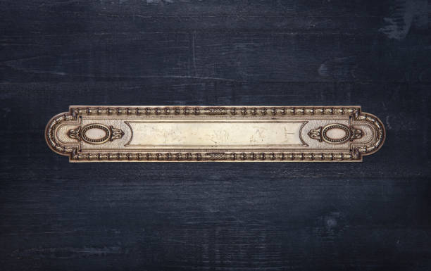 istock Ornate victorian metal frame on a black wood background 1348291346