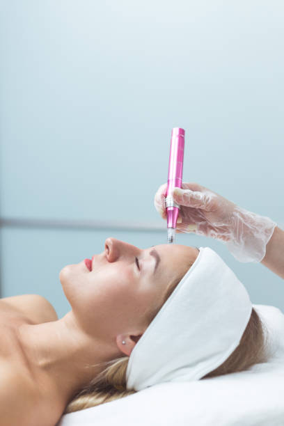 Woman having facial treatment in beauty salon, closeup. Oxy derma therapy stock photo