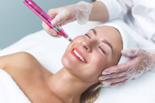 Woman having facial treatment in beauty salon, closeup. Oxy derma therapy stock photo