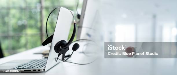 Headset And Customer Support Equipment At Call Center Ready For Actively Service Stock Photo - Download Image Now