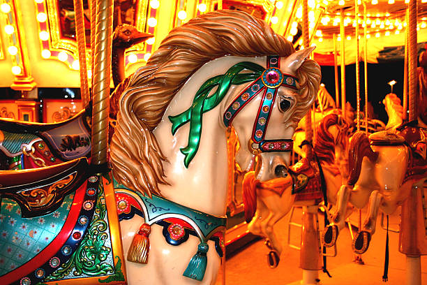 istock Amusement park carousel ride. Night. Horses. Colorful. 134830542